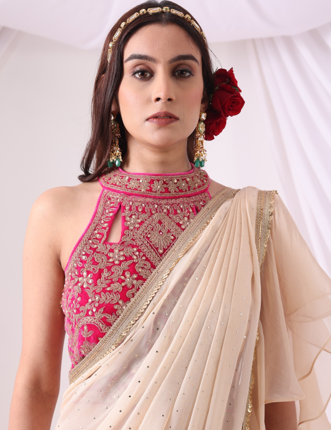 Beige Draped Saree with Magenta Halter Blouse