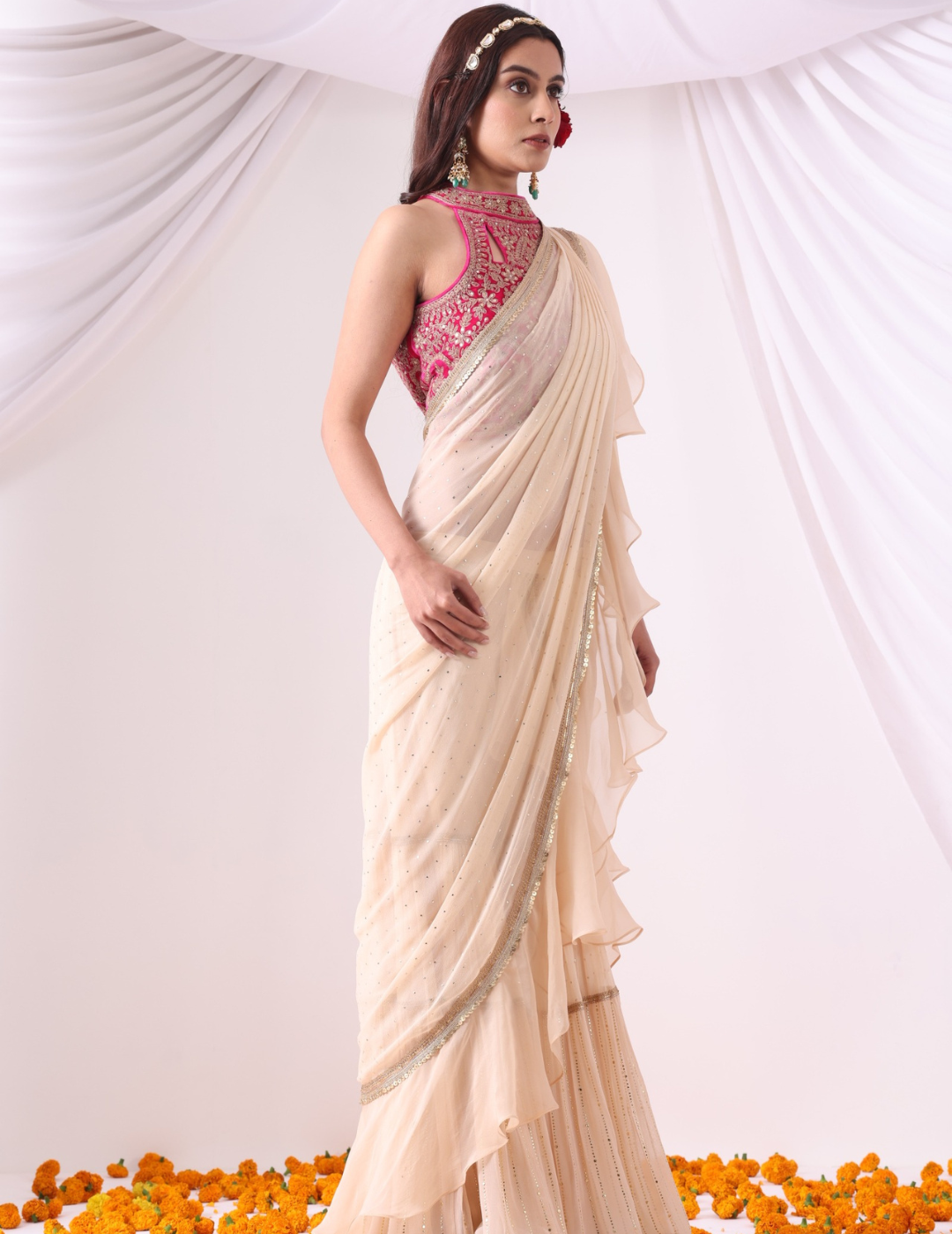 Beige Draped Saree with Magenta Halter Blouse