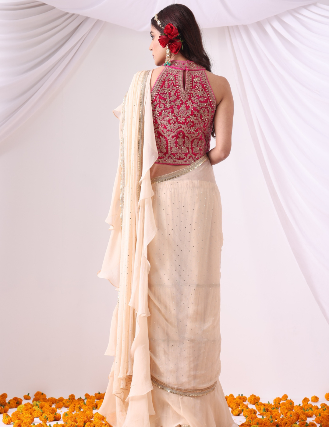 Beige Draped Saree with Magenta Halter Blouse